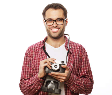 life style  and people concept: young man with a retro camera  on a white backgroundの写真素材