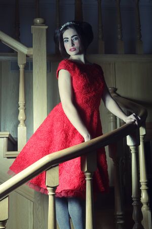 beautiful woman in elegant dress posing on stairs
の写真素材