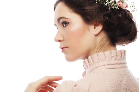 Portrait of beautiful young bride in pink dress  isolated on white background