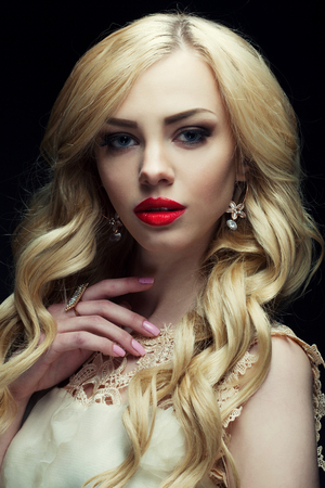 portrait of beautiful fashionable woman on dark backgroundの写真素材