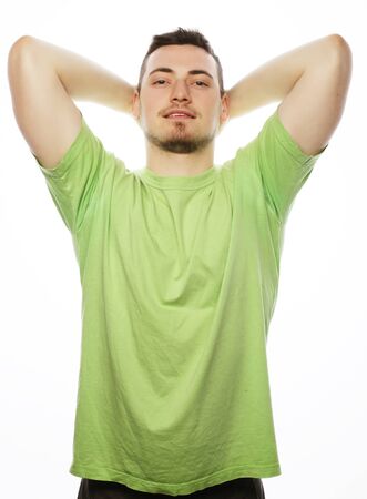 life style  and people concept: happy young man in green t-shirt. Isolated on white.の写真素材