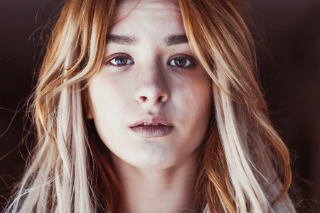 portrait of a beautiful sad girl closeup, cry in the city
