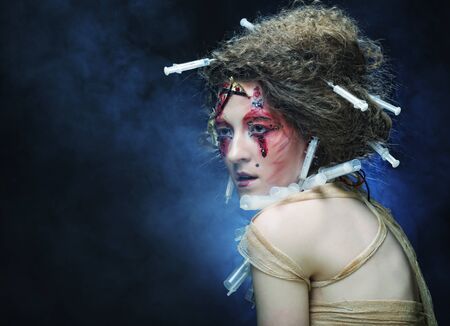 Young woman with creative make up. Halloween theme. Zombie theme.の写真素材