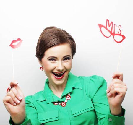 Attractive playful young woman ready for party - falce lips and glassesの写真素材