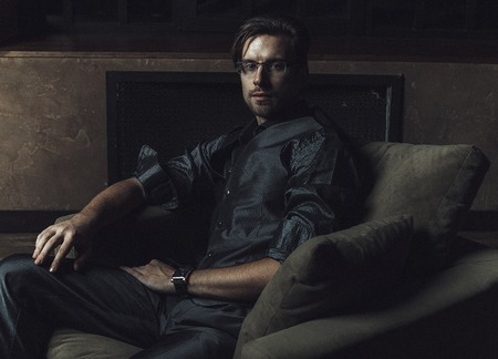 Businessman sitting on an armchair. Fahion man.の写真素材