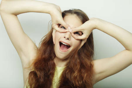 Beautiful young surprised woman. Studio shot.の写真素材