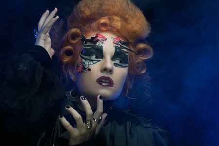 Gothic redhair witch. Dark woman.Halloween picture.の写真素材