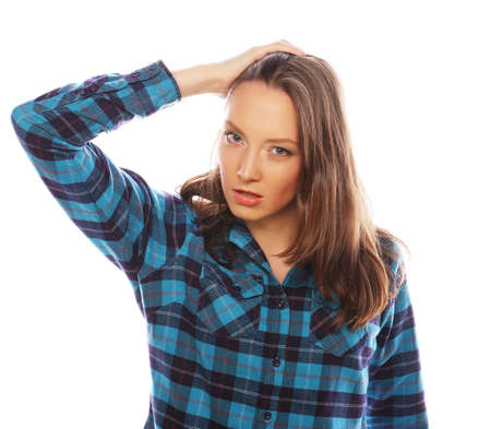 Beautiful young surprised woman. Studio shot.