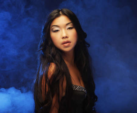 Beautiful young asian model. Studio shot.