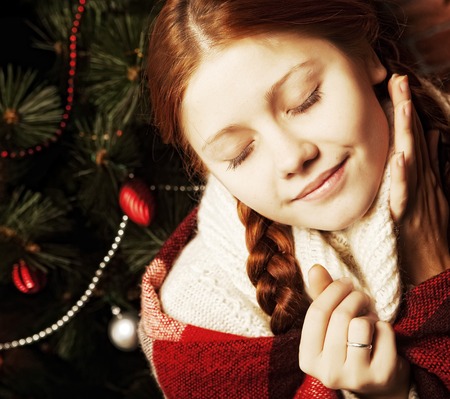 redhair christmas woman wit apple. Home interior.の写真素材