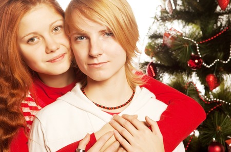 Two girl friends. Christmas holiday.の写真素材