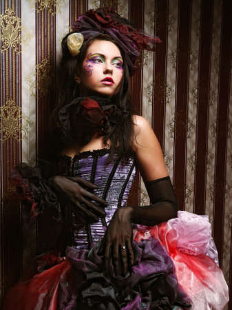 Fashion shot of woman in doll style. Creative make-up.Fantasy dress.の写真素材