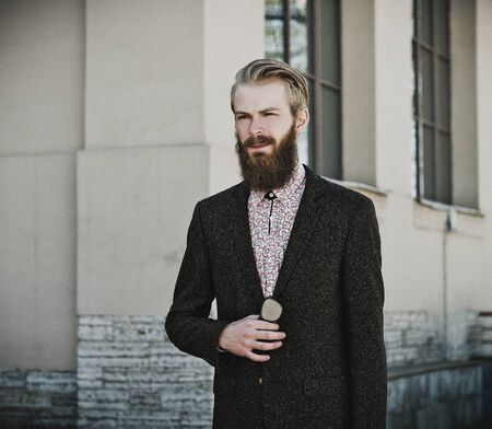 Portrait of young beautiful fashionable man outdoor