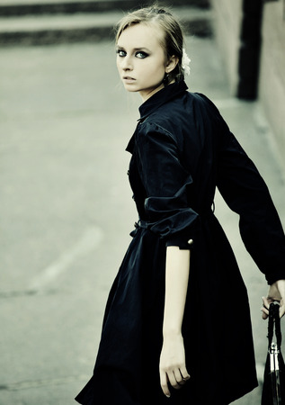 fashion model posing on a city streetの写真素材