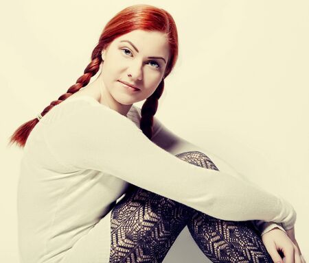 happy redhair woman on white backgroundの写真素材