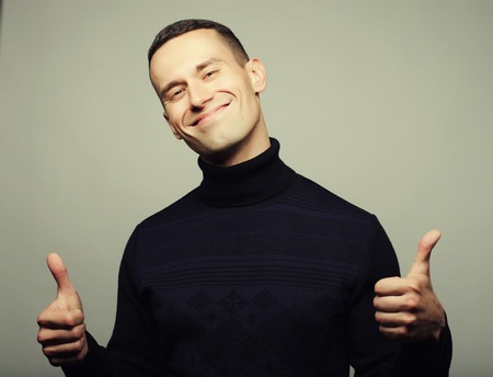 Handsome in style. Cheerful young man in smart casual wearの写真素材