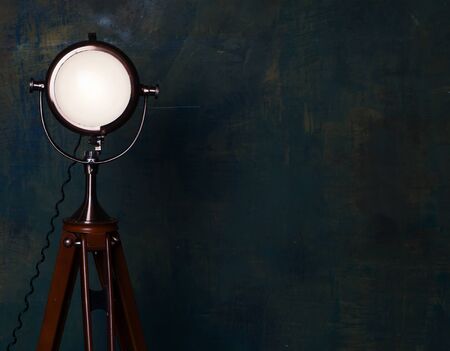 vintage floor lamp over old wallの写真素材