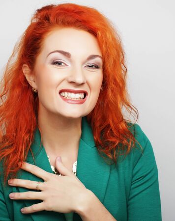 Beautiful young surprised woman. Studio shot.の写真素材