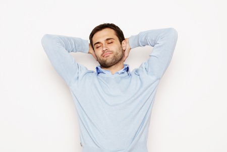 life style  and people concept: happy young man in blue shirt. Over white background.