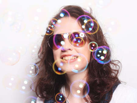 Young surprised woman wearing sunglasses. Emotional portrait.