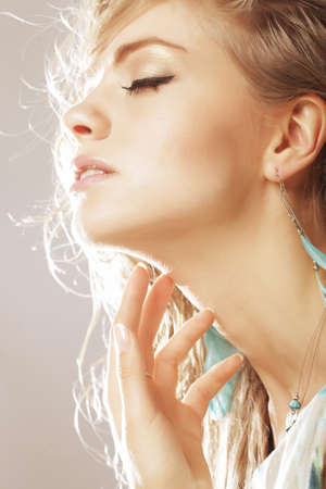 young blond woman studio shot
