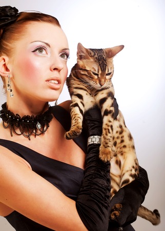 elegant young woman with catの写真素材