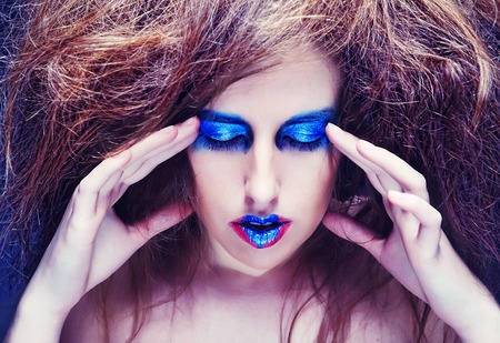 woman with blue visage. big hair.の写真素材