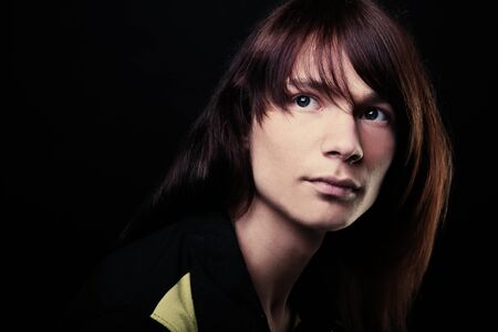 Young fashion man model posing in studioの写真素材