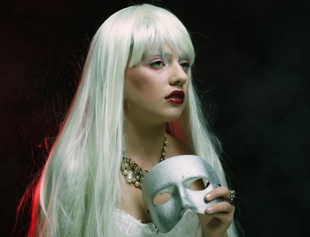 Photo of beautiful woman with silver maskの写真素材