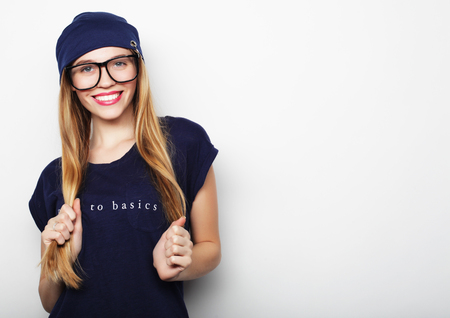 friendly blond woman with glasses, over white background