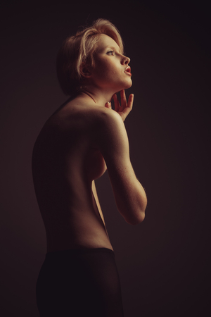 Elegant nude woman with short blond hair, studio shotの写真素材