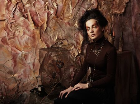 Beautiful brunette woman with bright creative make upの写真素材