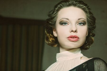 Beautiful woman portrait in classic interior. Vintage processingの写真素材