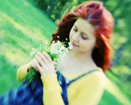 smiling redhaired girl, outdoorsの写真素材