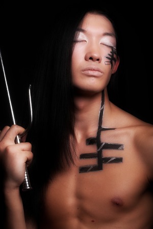 asian boy over black backgroundの写真素材