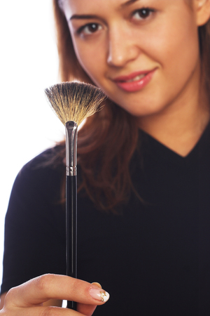 portrait of a cosmetician ready to work isolated on white backgroundの写真素材