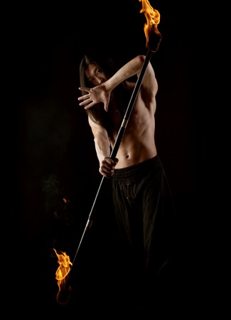 asian man with fire show