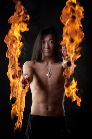 asian man with fire showの写真素材