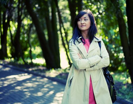 Woman relaxing outdoors smilingの写真素材