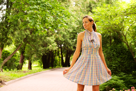 Woman relaxing outdoors smilingの写真素材