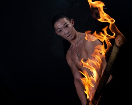 asian man with fire showの写真素材