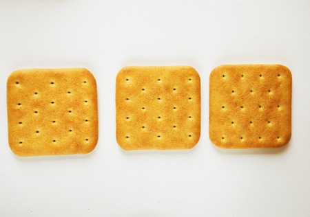 Cracker cookies over white backgroundの写真素材