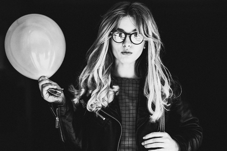 lifestyle, fashion and people concept: blonde girl, black and whの写真素材