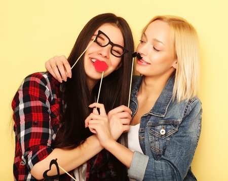 two stylish sexy hipster girls best friends ready for partyの写真素材