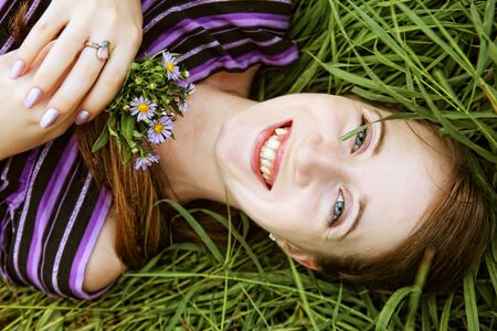 young smiling woman on the grass
