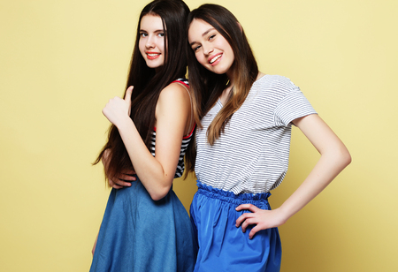 lifestyle and people concept: Two young girl friends standing toの写真素材