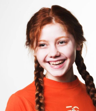 lovely redhead girl with long braidsの写真素材