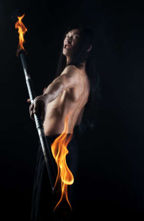 asian man with fire showの写真素材