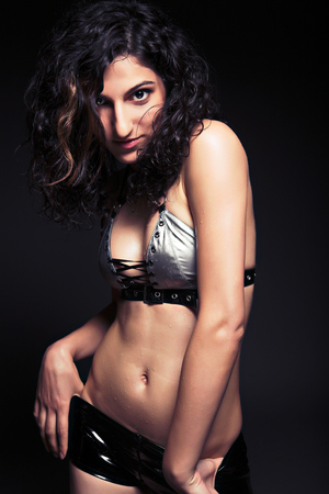 brunette woman dance on black backgroundの写真素材