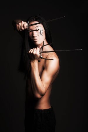 asian boy over black backgroundの写真素材